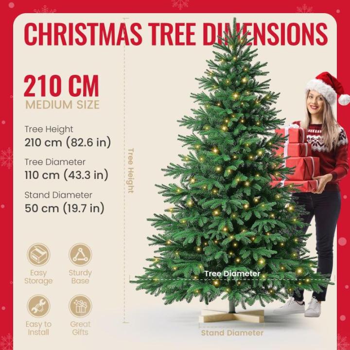 Kuro sagol Künstlicher Weihnachtsbaum Tannenbaum 210cm, Ø 110cm, 1150 Spitzen, schwer entflammbar, realistischer Christbaum Tanne mit Ständer, Schnellaufbau Klapp-Schirmsystem