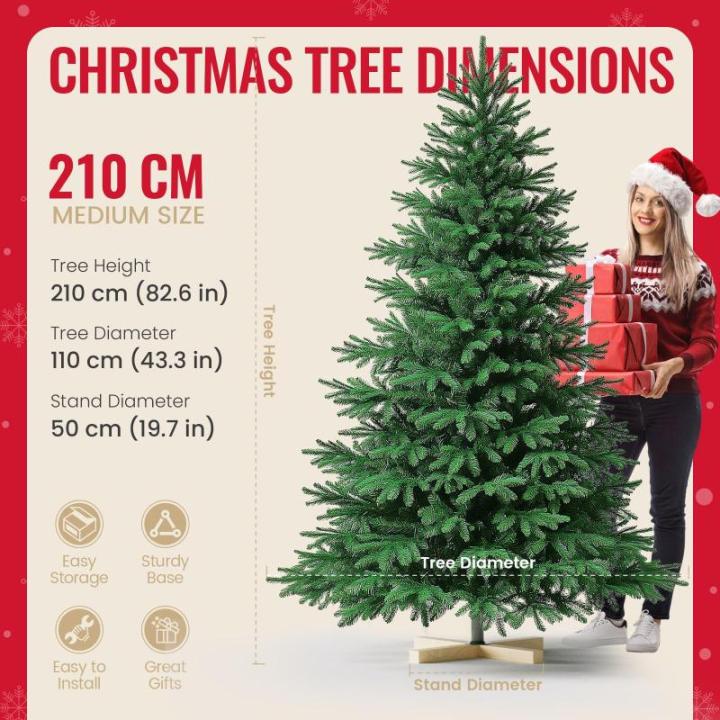 Kuro sagol Künstlicher Weihnachtsbaum Tannenbaum 210cm, Ø 110cm, 1150 Spitzen, schwer entflammbar, realistischer Christbaum Tanne mit Ständer